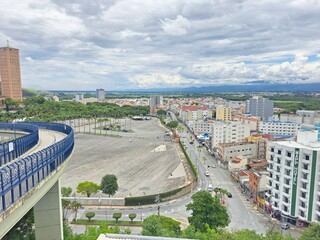 Aparecida, Sao Paulo, Brazil - November 30, 2022. View of the parking lot and the city from the footbridge that connects the old Basilica to the new Basilica of Aparecida.