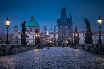 Naklejka premium Charles Bridge, Prague at dramatic evening, Czech Republic, with night lighting