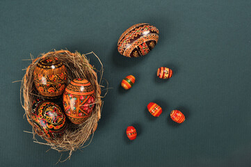 Handmade wooden Easter eggs with traditional Ukrainian ornament - obrazy, fototapety, plakaty