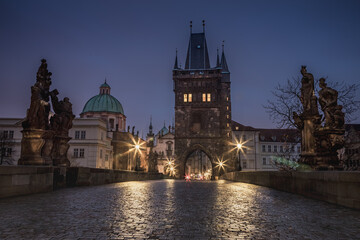 Fototapeta na wymiar Charles Bridge, Prague at dramatic evening, Czech Republic, with night lighting