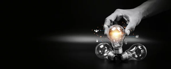 Foto op Plexiglas Close up hand choose light bulb or lamp with icons for human resources or leadership and creativity thinking idea motivation or vision and knowledge learning and study or education concept. © Jintana