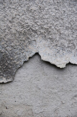 damaged and cracked concrete wall