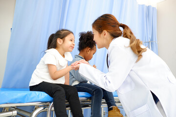 female doctor examining sick girl medical concept.