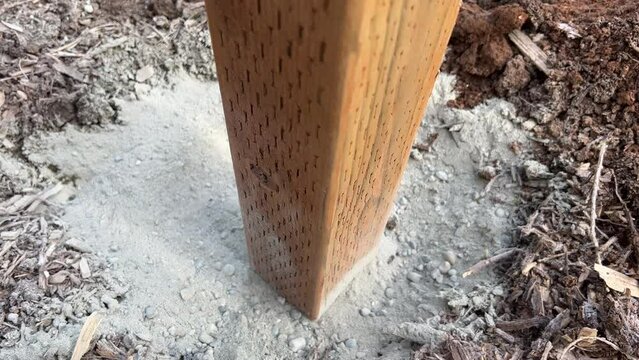 Fence Post Hole With Level String Ready for Concrete Wood Fencing Construction Concept