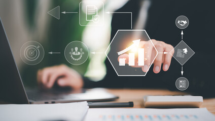 Businessman showing business process and workflow with virtual flowchart,planning and setting...