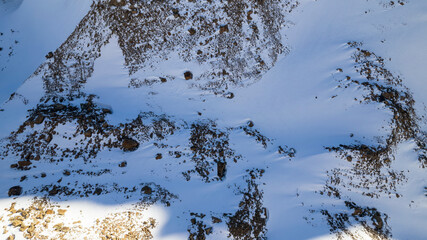 A huge frozen glacier in the mountains and a lot of tourists. Walking in the snow, taking photos...