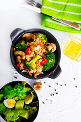porridge with mushroom and boiled broccoli in bowl