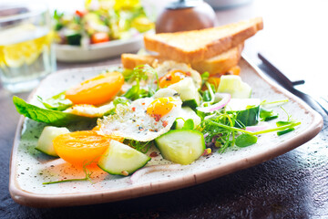 Avocado, vegetable and fried egg sandwich. Breakfast