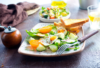 Avocado, vegetable and fried egg sandwich. Breakfast