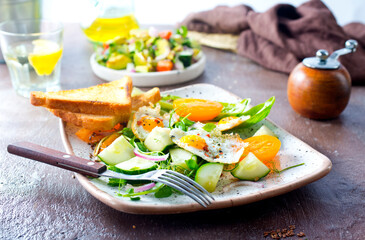 Avocado, vegetable and fried egg sandwich. Breakfast