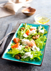 Sliced Feta cheese with tomato and olive oil.