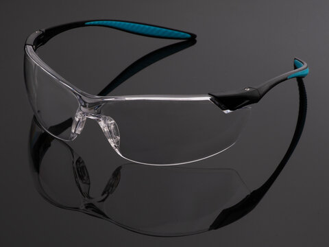 safety glasses on a black background