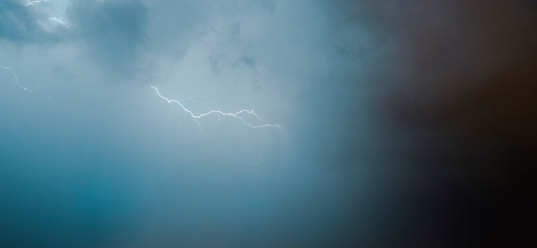Scenic view of thunderstorm against cloudy sky - Powered by Adobe