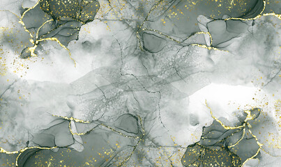 green alcohol ink graceful abstract ink flow art mixed with gold patterns with a translucent background.