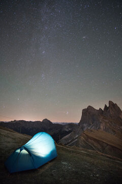 Majestic view of star field over illuminated tent