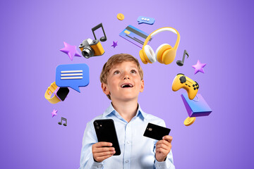 Happy boy with credit card and smartphone, online shopping and video games - obrazy, fototapety, plakaty