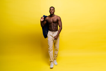 Young african man standing shirtless with a happy and cool smile on face. lucky person.