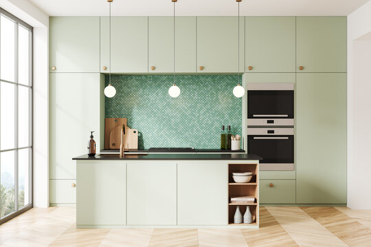 Green mosaic kitchen interior with island