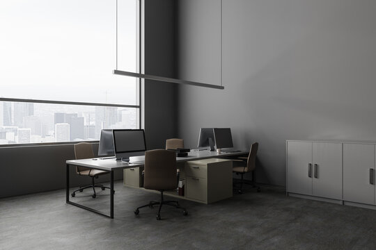 Workplace in stylish gray office