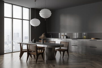 Grey home kitchen interior with dining table and panoramic window