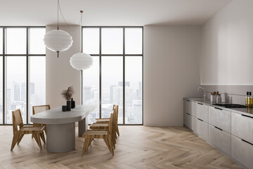 Stylish home kitchen interior with cooking and dining area, panoramic window