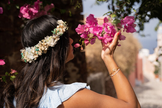 Lady smelling flowers