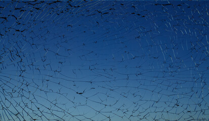 Dark blue broken shattered glass with black cracks and sky on background