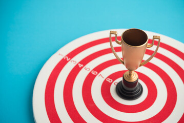 Gold winner trophy on center target copy space. Successful and achieve target goal in business,...