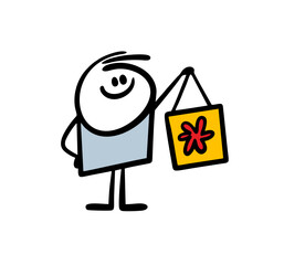 Happy little boy holds shopping bag with flower print.