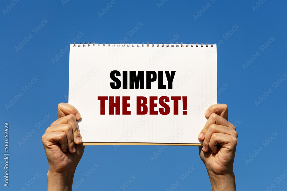 Poster simply the best text on notebook paper held by 2 hands with isolated blue sky background. this messa
