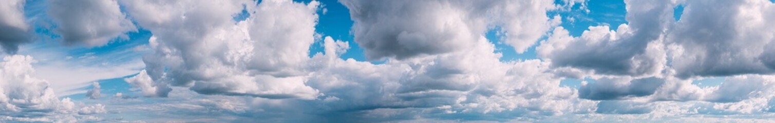 Naklejka na ściany i meble Panorama Of Cloudy Sky. Natural Day Cloudy Sky Abstract Background. Panorama Panoramic View. Backdrop. Copy Space. Bright Blue.