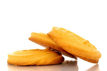 Three sweet cookies with butter, macro, isolated on white background.