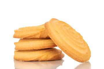 Several sweet cookies with butter, macro, isolated on white background.
