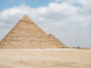 Giza pyramid complex. Photo of pyramids on a clear, sunny day against a blue sky. Vacation and travel concept