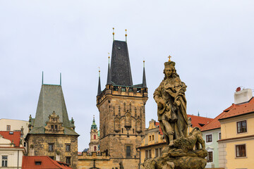 Fototapeta na wymiar Ancient medieval sculptures on the Charles Bridge. Background with selective focus
