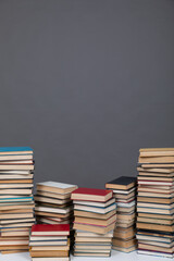 a large number of books on a gray background in the library of science knowledge reading