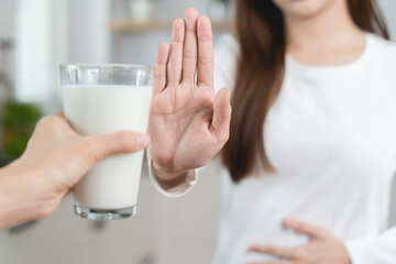 lactose intolerance concept. Woman having a stomach ache from lactose intolerance.