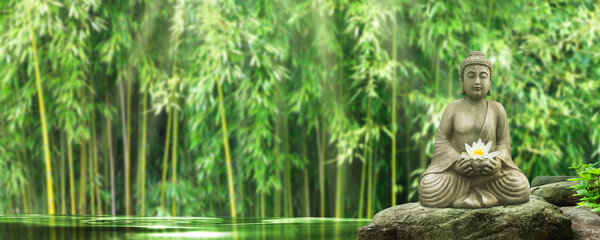 meditating buddha on a rock in an idyllic bamboo garden, sunshine on green water surface, wallpaper...