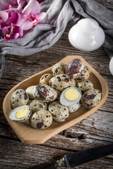 Quail eggs on a wooden table.