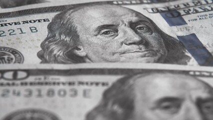 100 US dollar banknotes of the new design rotate closeup