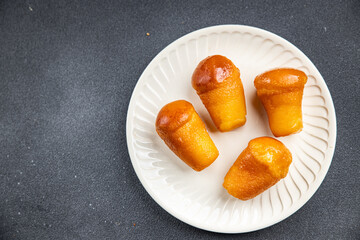 baba rum sweet alcohol dessert cake meal food snack on the table copy space food background rustic top view