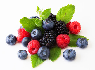 Various berries isolated on white background. Raspberry, Blueberry, Cranberry, Blackberry and Mint leaves