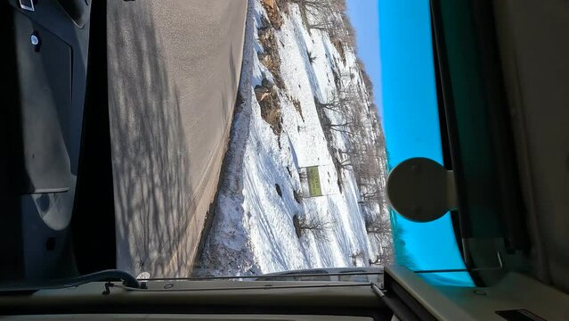 A view from the front window of the bus, on the way up Mount Hermon which is covered in snow, winter