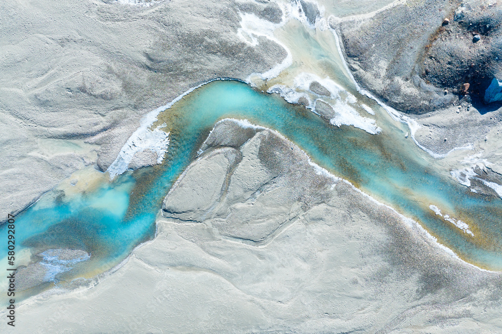 Wall mural drone view of the azure river in the glacier valley. view of the moraines. landscape from the air. r