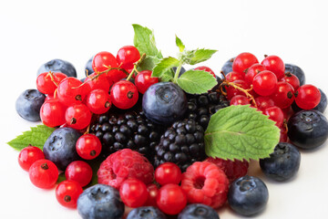 Mix berries with leaf. Various berries isolated on white background.