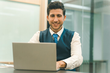 Businessman entrepreneur professional working on laptop.