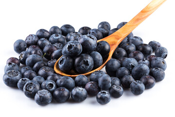 Fresh blueberries in wooden spoon