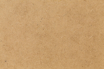 Pressed beige chipboard texture.