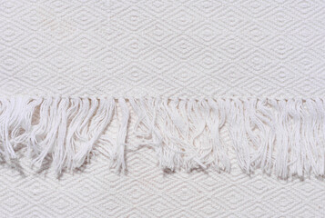 Fragment of a kitchen towel with a fringe