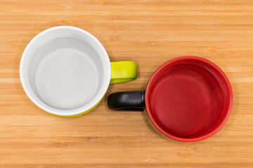 Two empty cups white and red inside, top view